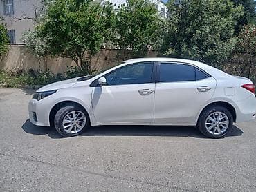 Toyota Corolla: 1.6 l | 2014 il Sedan — 2