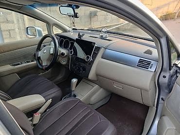 Nissan Tiida: 1.6 л | 2007 г. Седан