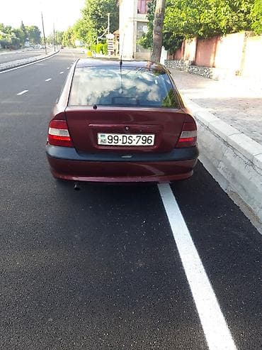 opel omega b: Opel Vectra sedan – vişnə rəngi, 4 qapı, qara disklər, tonlu şüşələr — 4