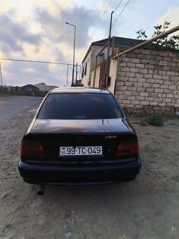 aston martin db7 5.9 at: BMW 5 series: 3.5 l | 1998 il Sedan — 2