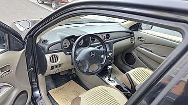 qara maşın: Mitsubishi Outlander – şəhər və yolsuzluq üçün praktik krossover. - — 6
