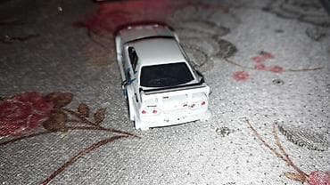 2107 modeli: Kolleksiya üçün die-cast model avtomobil – Nissan Skyline GT-R (R34) — 2