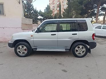 Mitsubishi: Mitsubishi Pajero iO (5 qapı) SUV - Kuzov: ağ/gümüş iki rəngli, yan — 2