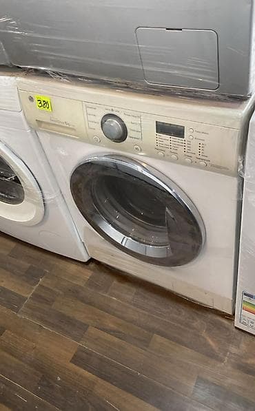 irşad electronics paltaryuyan lg: Ön yükləməli, ağ rəngli paltaryuyan maşın. Maşının ön hissəsində — 1