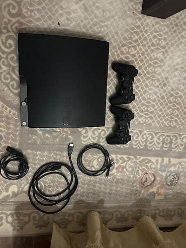 sony a6500: Sony PlayStation 3 (PS3) Slim oyun konsolu dəsti Paketə daxildir: - — 2