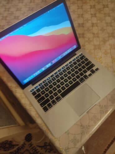 Apple MacBook noutbuk - Korpus: alüminium gövdə, iri touchpad, işıqlı