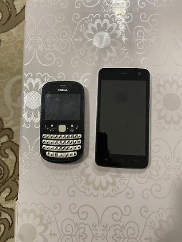 telofonar: Iki telefon birlikdə. 1) Nokia Asha 200 seriyası tipli düyməli — 3