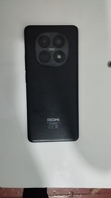 resmi 10 s: Arxa tərəfində "REDMI" brendi və "108MP" yazısı olan qara rəngli — 1