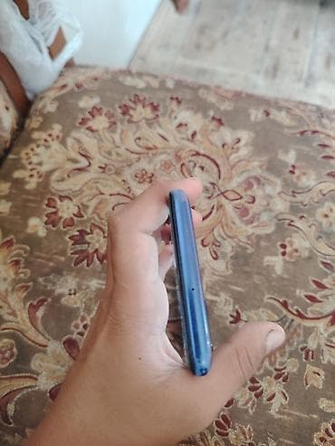 samsung printer: Mavi korpuslu smartfon - Korpus: parlaq mavi rəng, yuvarlaq kənarlar — 1