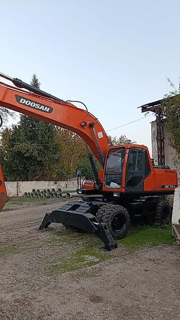 Su nəqliyyatı: Doosan DX210W təkərli ekskavator - Marka/model: Doosan DX210W - Növ — 1