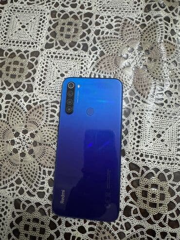 şirə çəkən: Xiaomi Redmi smartfon - Model: Redmi (mavi korpus) - Ekran: Tamölçülü — 2