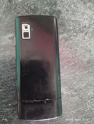 телефон fly q: Təsvir: - Düyməli mobil telefon, ön paneldə “SANUSMG” loqosu və “DUOS” — 2