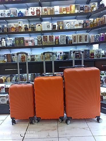 Çamadanlar: Portativ səyahət çamadan dəsti – 3 ölçüdə - Rəng: narıncı - Korpus — 1