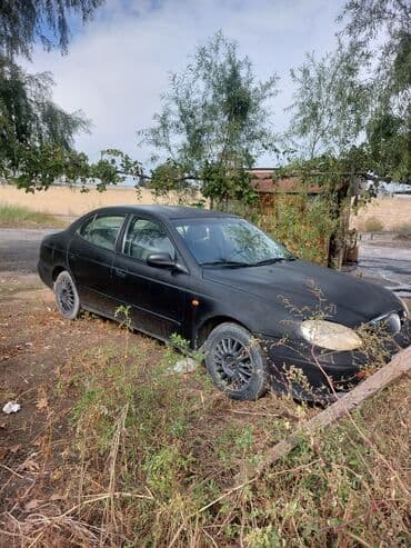 mersedes disk teker: Daewoo Leganza: 2 l | 1998 il Sedan — 5