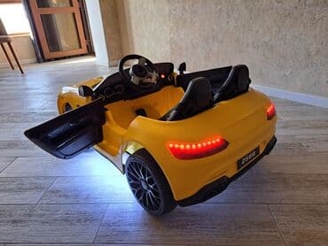 детский мотоцикл каталка: Uşaq üçün elektrikli ride-on avtomobil – sarı rəngdə sport kabriolet — 4