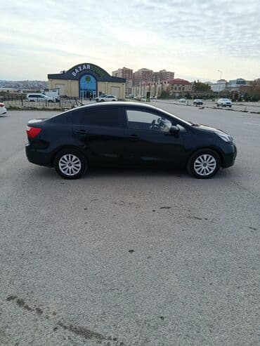 kvadrasikl satisi: Kia Rio sedan – qara rəng, 4 qapılı, kompakt şəhər avtomobili satılır — 2