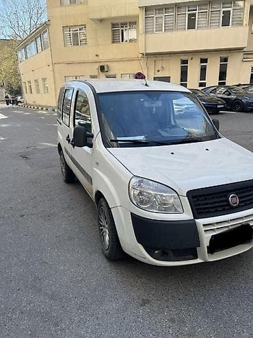 fiad doblo: Fiat Doblo (ağ rəng) – praktik və funksional miniven Xüsusiyyətlər: - — 2