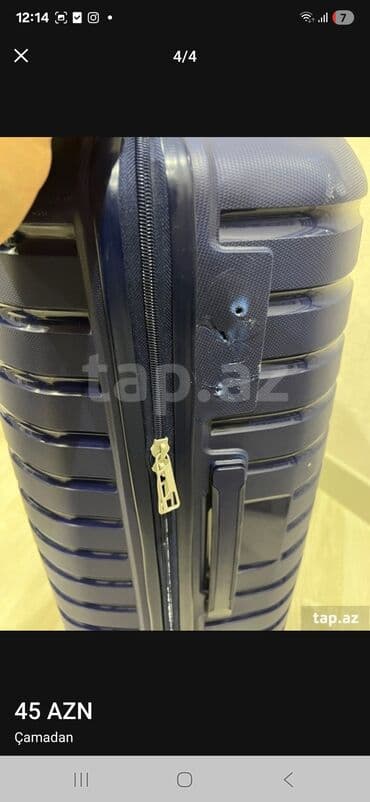 İdman qidaları: Dörd təkərli, tünd göy rəngli səyahət çamadanı. Çamadanın ön — 3