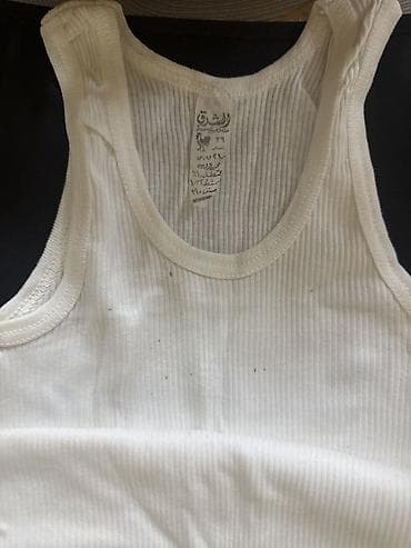 nike corab: Ağ rəngli, qolsuz uşaq maykası. Klassik dairəvi yaxa quruluşuna — 2