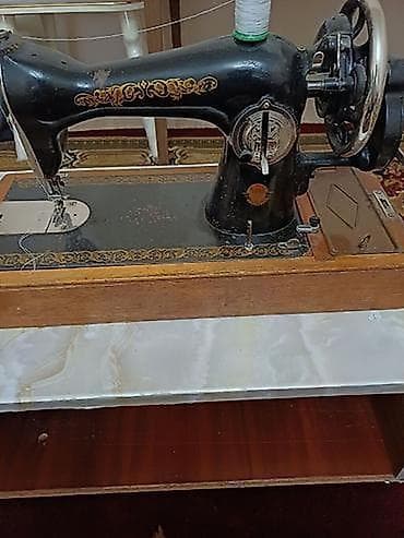 modelka maşınlar: Məhsul: Mexaniki tikiş maşını (köhnə tip, əl fırladan) Təsvir: - — 2