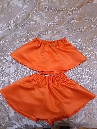 Юбки: - Məhsul: 2 ədəd narıncı rəngli qız uşaq ətəyi (komplekt) - Material — 1