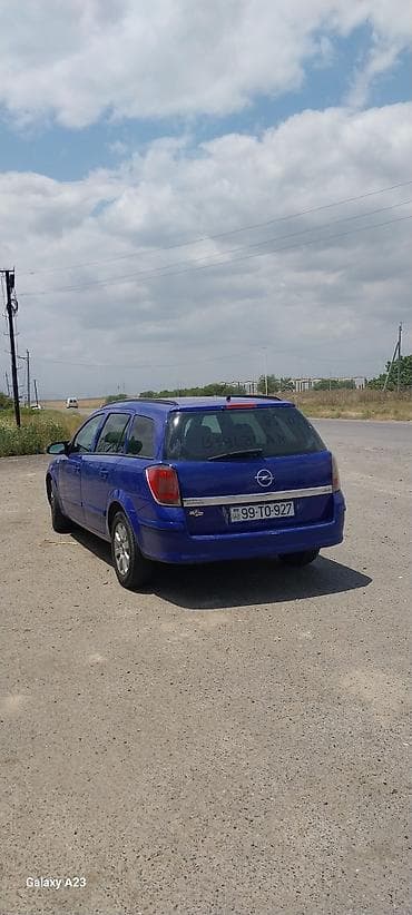 larzon disk: Opel Astra Caravan (universal), mavi rəng. Kuzov: 5 qapılı, geniş — 1