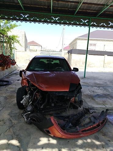 Kia Rio hatchback (CRDI, Sport paket yazıları ilə). Narıncı-qara iki — 4