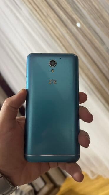 телефон fly evo chic 4: ZTE v889m, 512 ГБ, цвет - Голубой, Сенсорный — 2