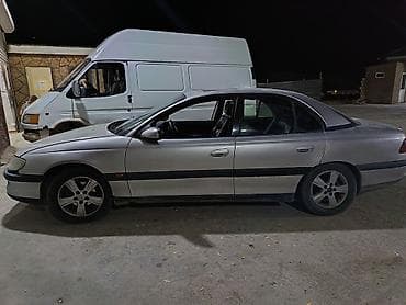 Opel Omega sedan - Kuzov: 4 qapılı sedan, gümüşü rəng - Ban lalafo.az -da Opel Omega sedan - Kuzov: 4 qapılı sedan, gümüşü rəng - Ban