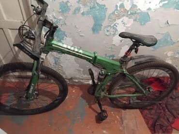 asma mühərrikli velosiped nədir: Dağ velosipedi – qatlanan gövdəli model Xüsusiyyətlər: - Rəng: yaşıl — 1