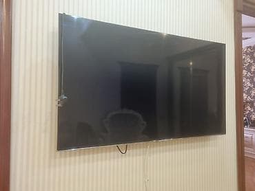 mini televizor: Divar asılqanlı böyük ekran televizor Xüsusiyyətlər: - Təxmini — 1