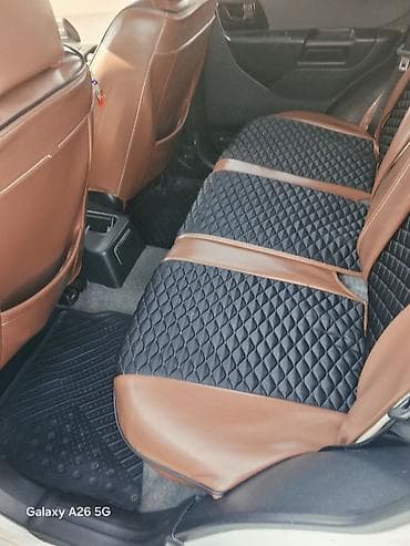 pajero mini: Mitsubishi Pajero iO, ağ rəngli, 5 qapılı kompakt SUV. - Benzinlə — 7