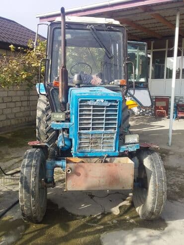 yük daşima: MTZ tipli mavi traktor - Kabinəli, iki qapılı konstruksiya, geniş ön — 3