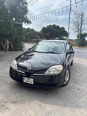 ravon 2: Nissan Primera: 2 l | 2005 il Sedan — 10