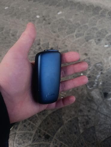 Ploom markalı tünd rəngli elektron siqaret. Kənarları — 1