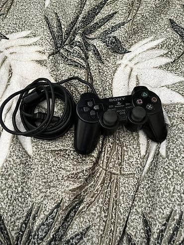 PlayStation 2 Slim (SCPH seriyası) oyun konsolu Xüsusiyyətlər: - — 4