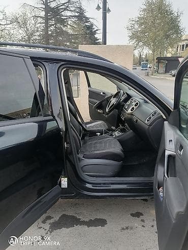 mercedes e 2: Volkswagen Tiguan: 2 l | 2009 il Ofrouder/SUV — 7