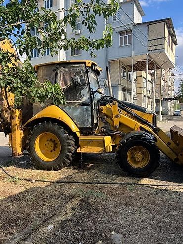 mini yer sumlayan: Caterpillar 428E ekskavator-yükləyici - Marka/model: Caterpillar 428E — 1