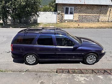 46 kuza: Opel Vectra Caravan (Universal), tünd mavi rəng. Xüsusiyyətlər: - — 4