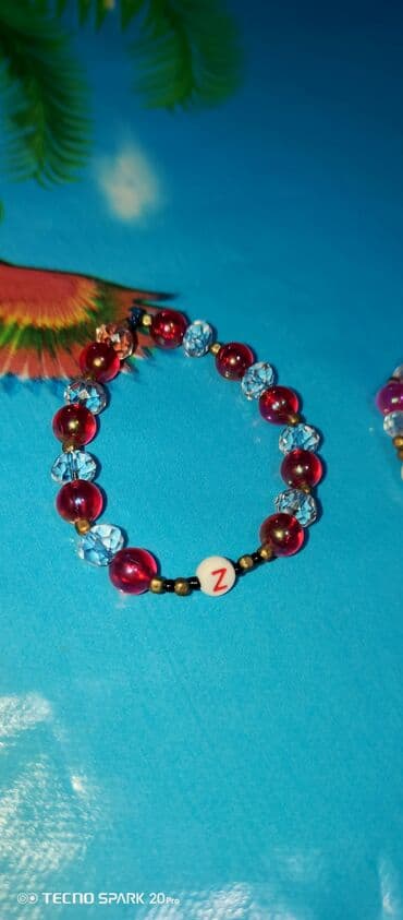 qizil bilerzik qiymeti: Uşaq üçün boncuk bilərziklər - Material: akril boncuklar, şəffaf — 1