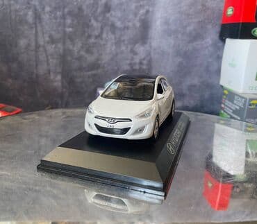 maşın modeli: Коллекционная модель Hyundai i30 5 door white 2012 Pino B&D Scale — 12