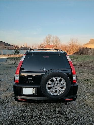 ucuz maşin: Honda CR‑V (II nəsil) – qara rəngli, 5 qapılı krossover/SUV — 7