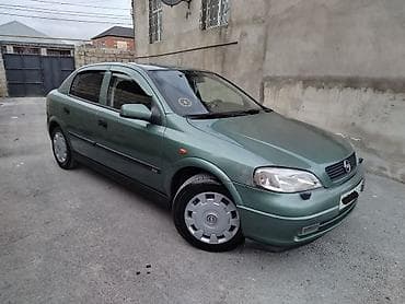 formula tekerler: Opel Astra: 1.8 l | 1999 il 250000 km Sedan — 1