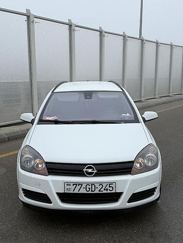 elektrikli moped: Opel Astra H Caravan (Universal), ağ rəng Texniki xüsusiyyətlər və — 2