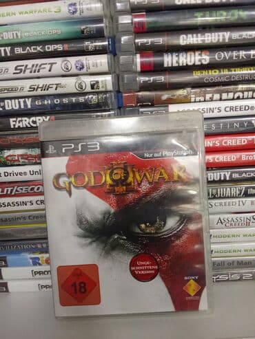 диск: PlayStation 3 üçün "God of War" oyun diski. Bu, döyüş və macəra — 1