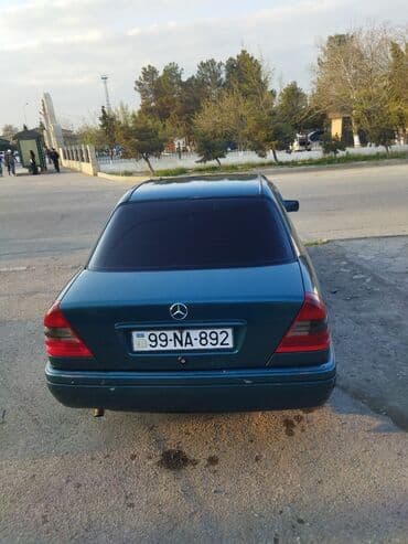 бампер на мерседес w210: Mercedes-Benz markalı, tünd firuzəyi rəngli sedan. Avtomobil rahat və — 4