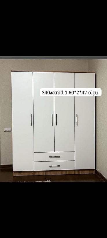 siyirmeli skaf: Ağ rəngli 4 qapılı paltar dolabı – 2 ədəd alt çekmece ilə. Ölçü: 1.60 — 1