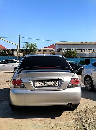 cəliloğlu avto: Mitsubishi Lancer sedan – gümüşü rəng, qara disklər. Nömrə: 77-NE-396 — 5