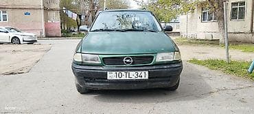 Opel Astra F Caravan (universał), yaşıl rəng. Xüsusiyyətlər: - Kuzov