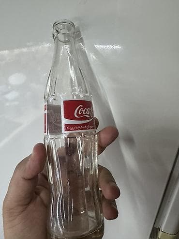 Məhsul: Şüşə Coca‑Cola butulkası Təsvir: - Həcm: 0.25 L (etiketdə — 4